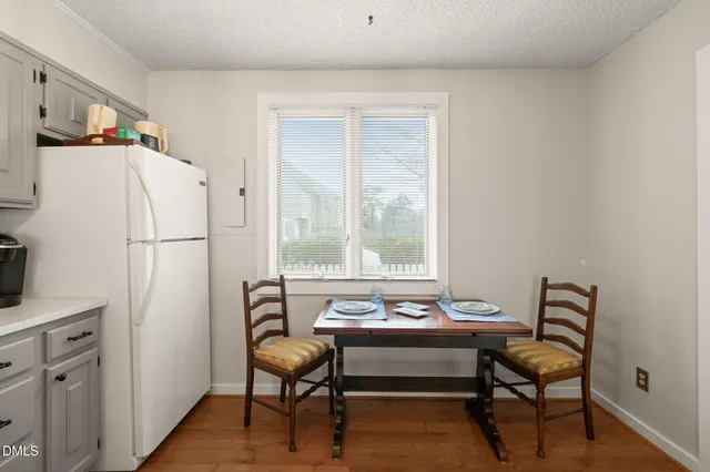 a view of a livingroom with furniture and a window