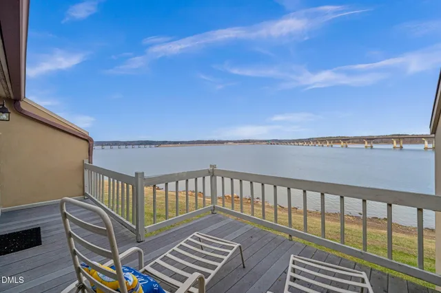 a view of a balcony with wooden floor