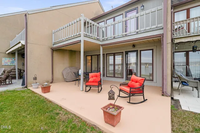 a backyard of a house with outdoor seating