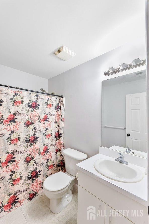 724 Edpas Road New Brunswick, NJ 08901 - Photo 14 of 24 a bathroom with a sink toilet mirror and shower