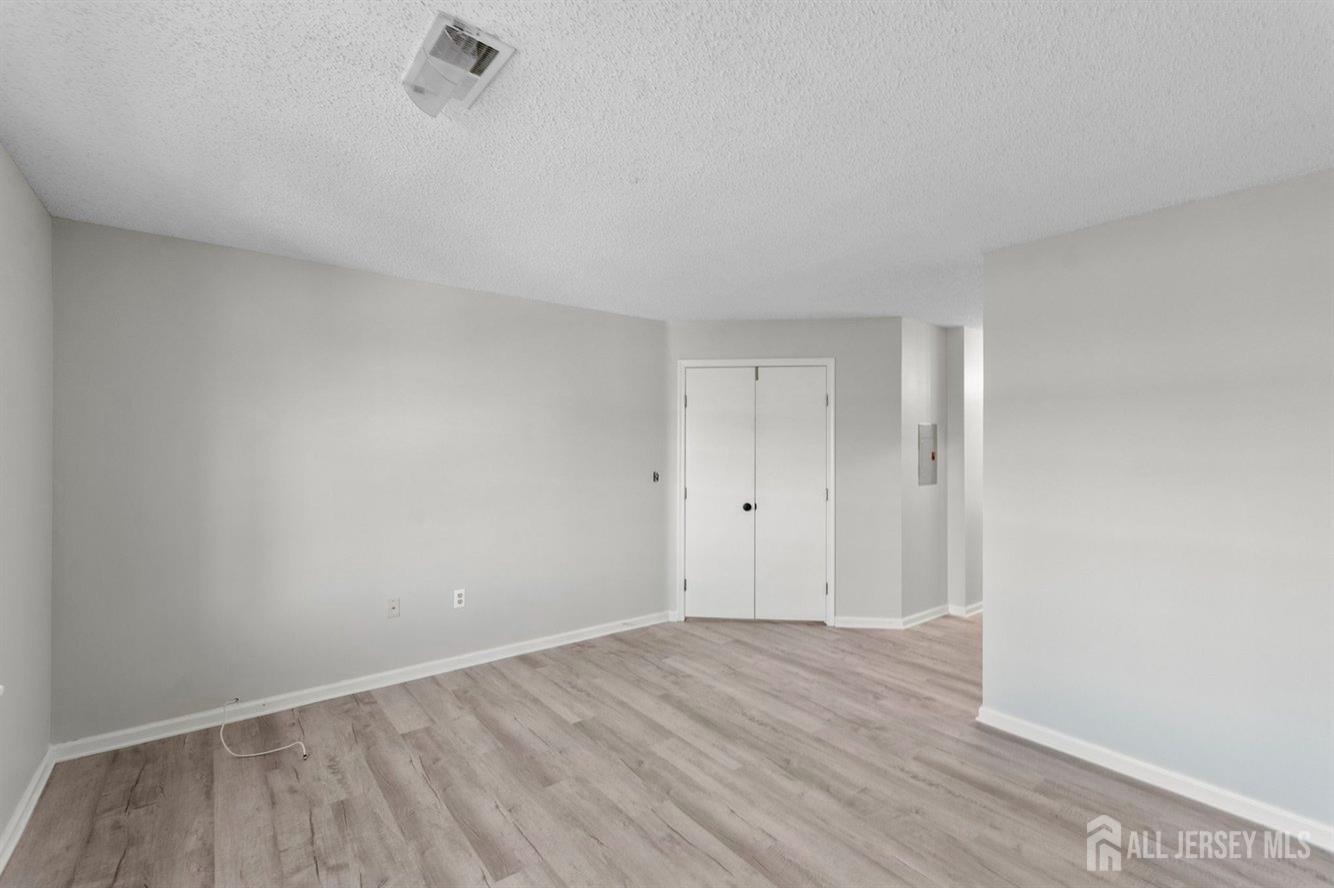 724 Edpas Road New Brunswick, NJ 08901 - Photo 17 of 24 a view of an empty room and wooden floor