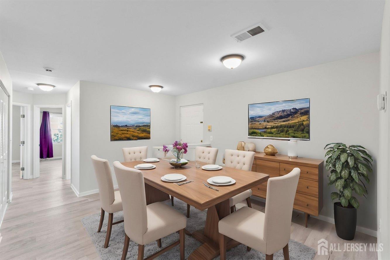 724 Edpas Road New Brunswick, NJ 08901 - Photo 2 of 24 a dining room with furniture and wooden floor