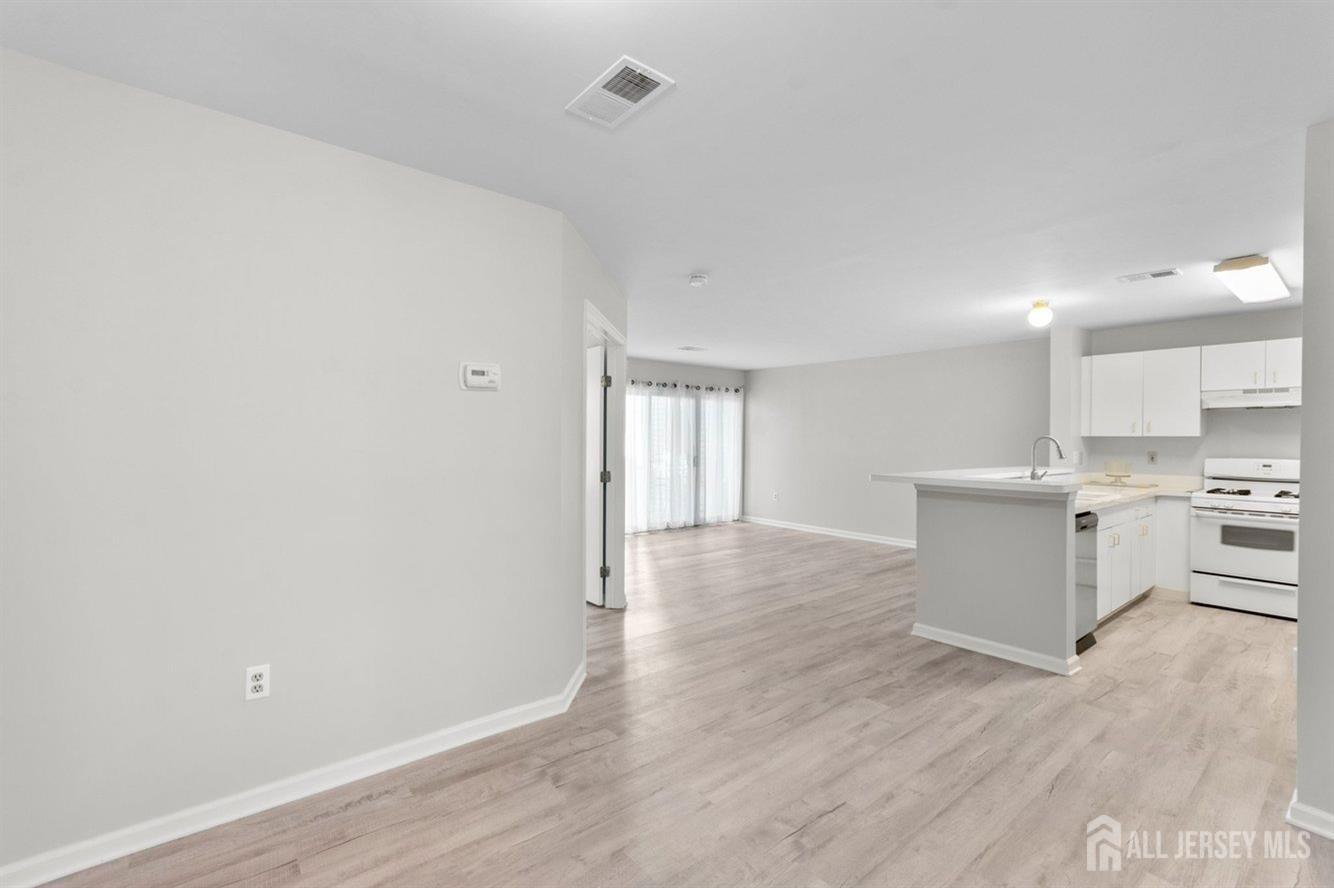 724 Edpas Road New Brunswick, NJ 08901 - Photo 4 of 24 a view of a kitchen with a sink and a stove top oven