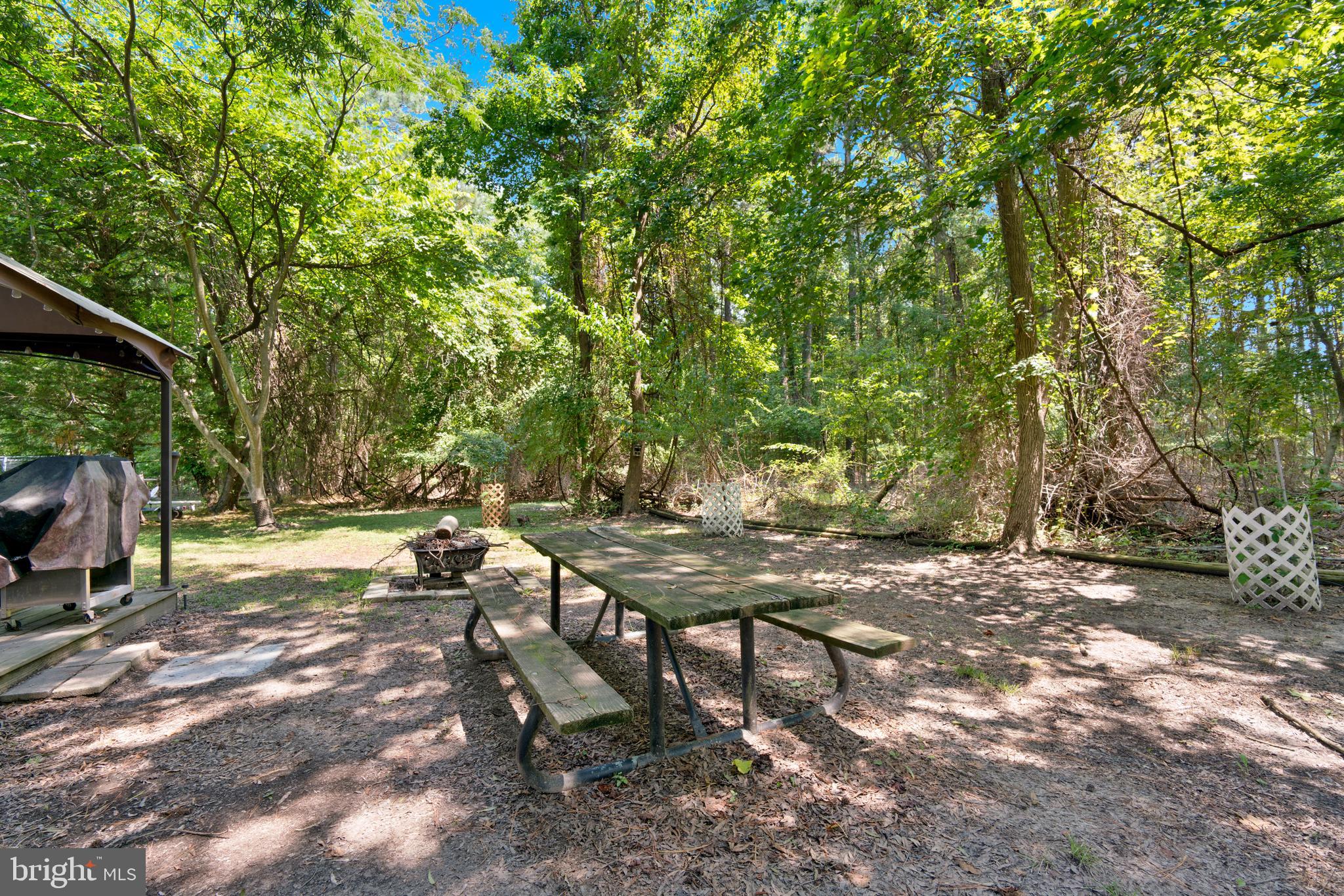 111 Beach Harbor Road, Unit 11F Grasonville, MD 21638 - Photo 12 of 13 a view of a backyard with sitting area