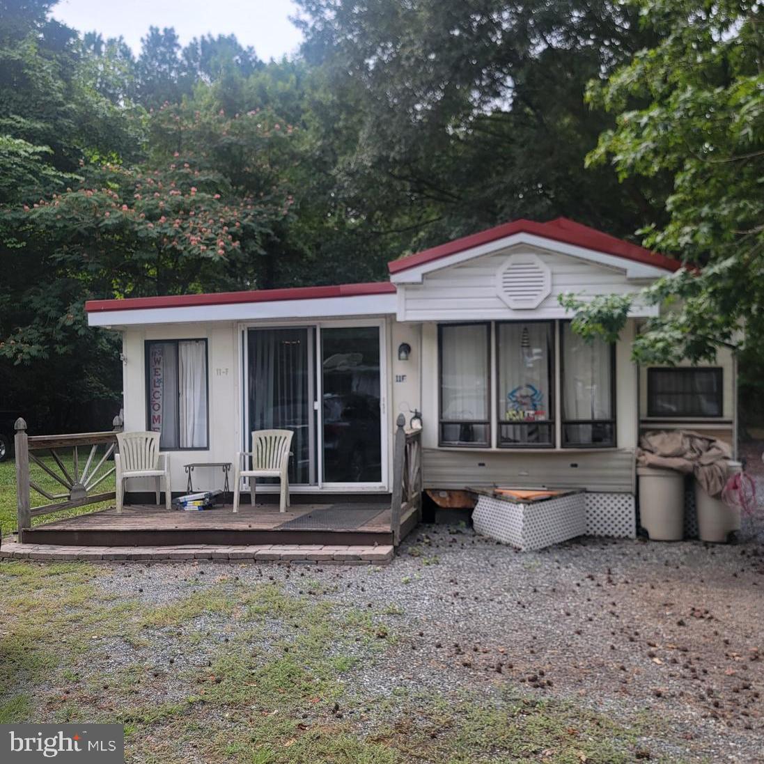 111 Beach Harbor Road, Unit 11F Grasonville, MD 21638 - Photo 2 of 13 a front view of a house with porch