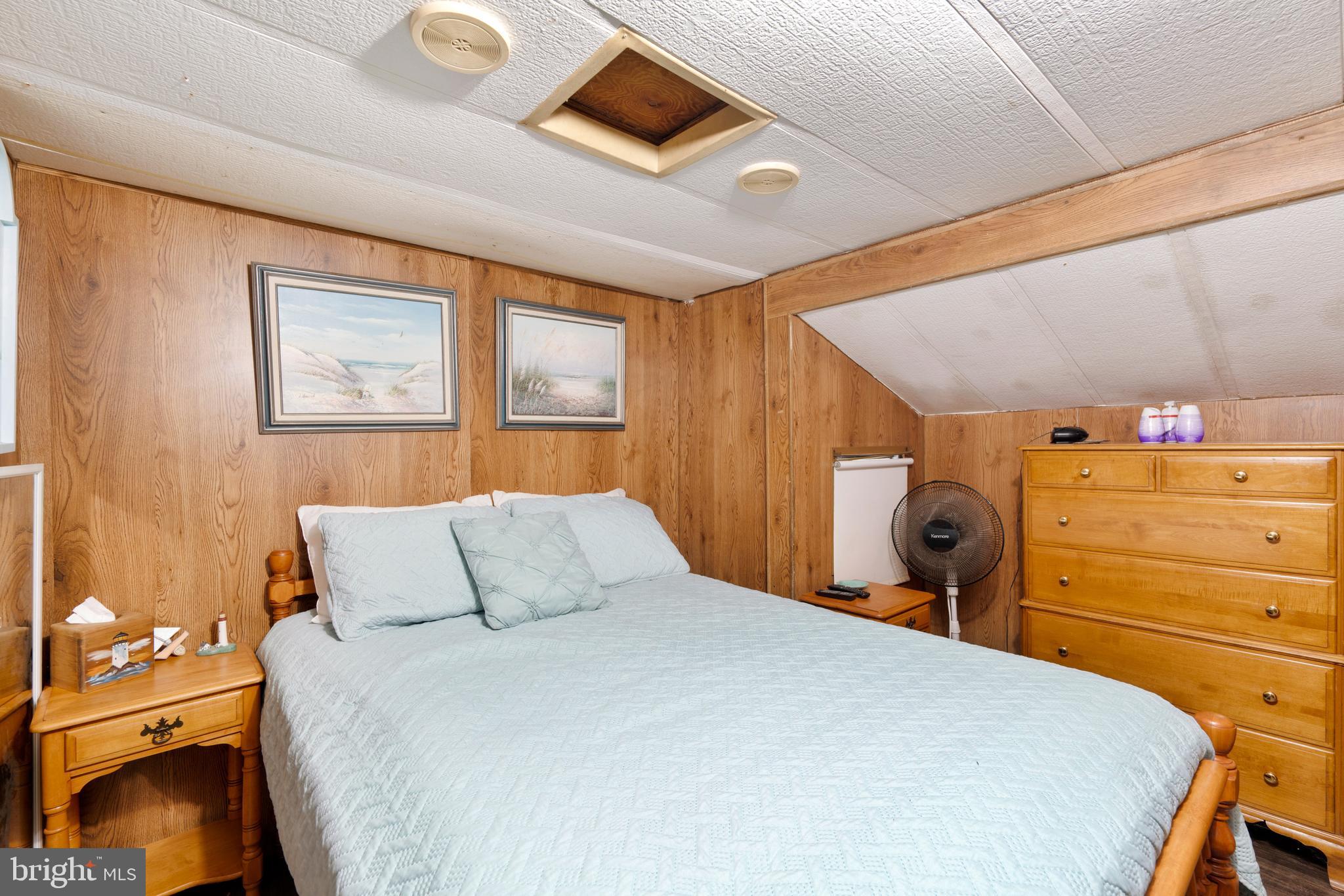 111 Beach Harbor Road, Unit 11F Grasonville, MD 21638 - Photo 6 of 13 a bedroom with a bed and a closet