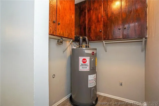 an empty room with closet and a chandelier fan