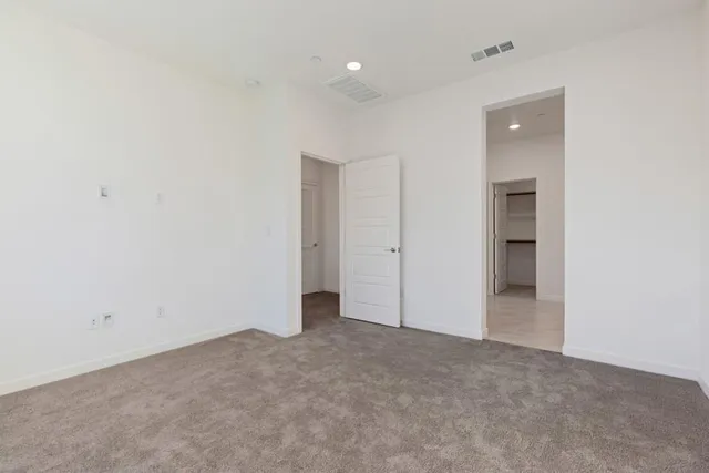 a bathroom with 2 sink and a large mirror