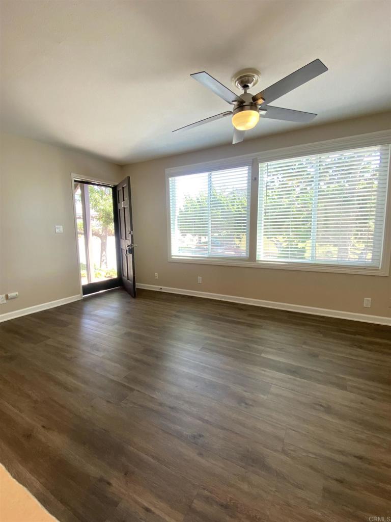 2088 Montgomery Avenue, Unit M Cardiff-by-the-Sea, CA 92007 - Photo 13 of 43 a view of an empty room with wooden floor and a window