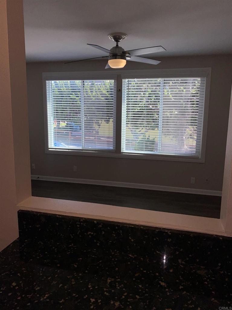 2088 Montgomery Avenue, Unit M Cardiff-by-the-Sea, CA 92007 - Photo 23 of 43 a view of empty room with wooden floor and a window