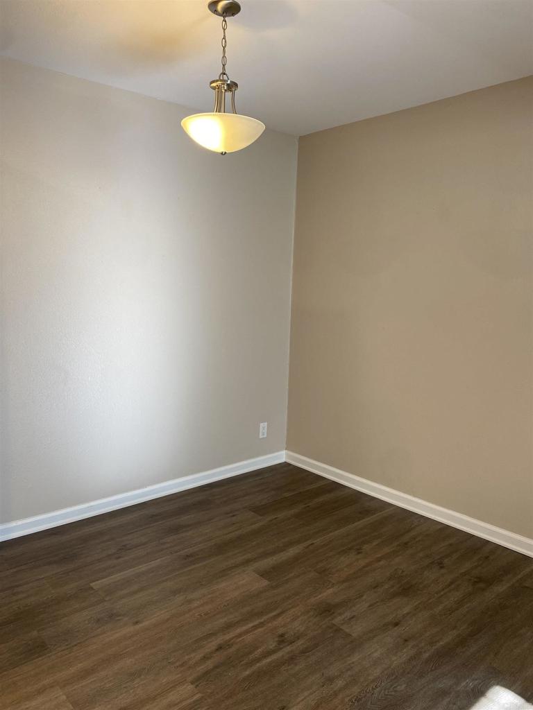 2088 Montgomery Avenue, Unit M Cardiff-by-the-Sea, CA 92007 - Photo 26 of 43 a view of an empty room with a chandelier fan
