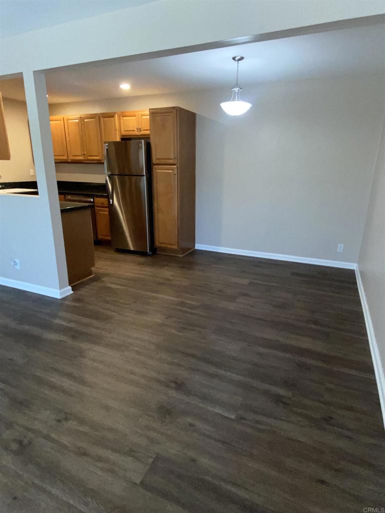 2088 Montgomery Avenue, Unit M Cardiff-by-the-Sea, CA 92007 - Photo 27 of 43 a view of empty room with wooden floor