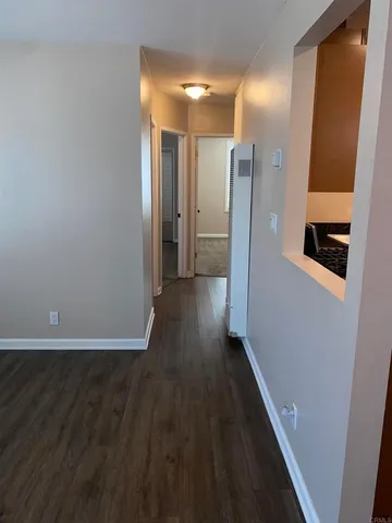a view of a bathroom with wooden floor