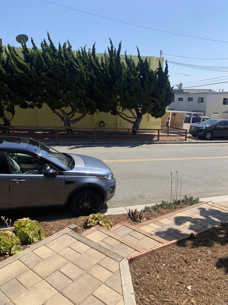 2088 Montgomery Avenue, Unit M Cardiff-by-the-Sea, CA 92007 - Photo 3 of 43 a car parked on the side of a road