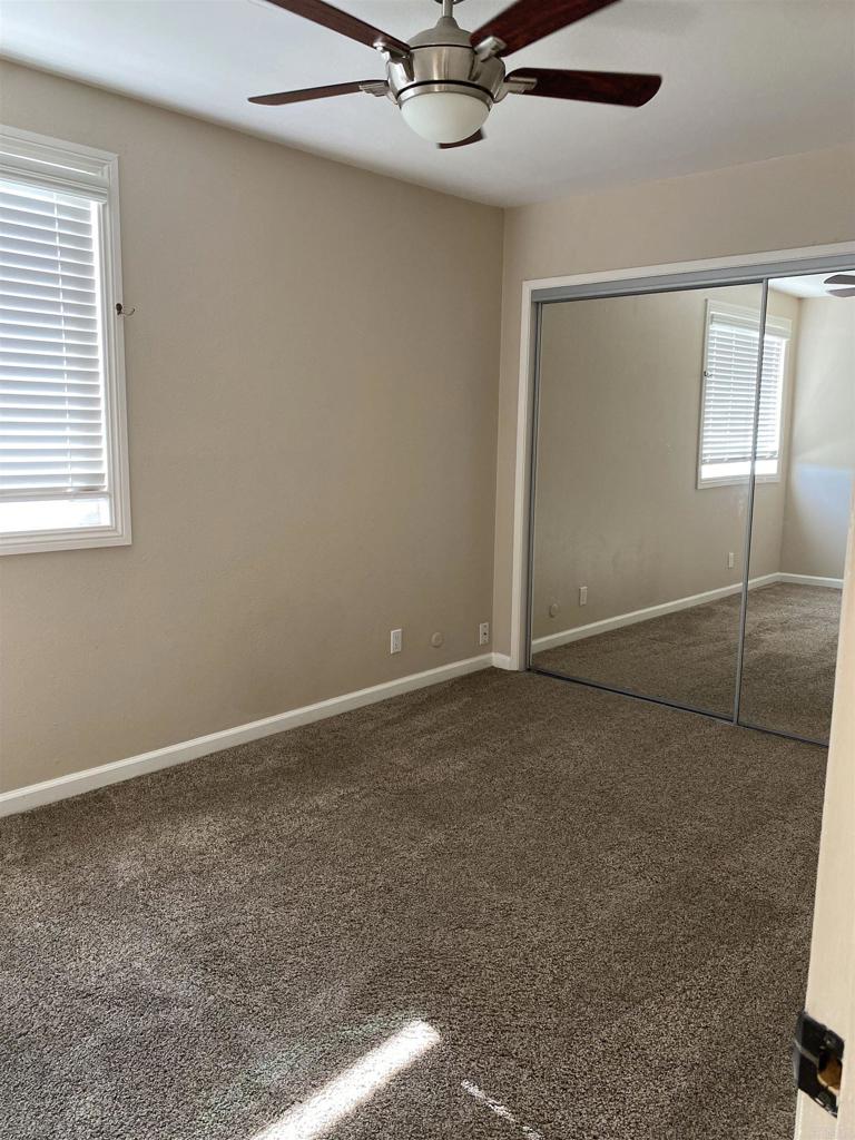 2088 Montgomery Avenue, Unit M Cardiff-by-the-Sea, CA 92007 - Photo 32 of 43 an empty room with a fan & a window