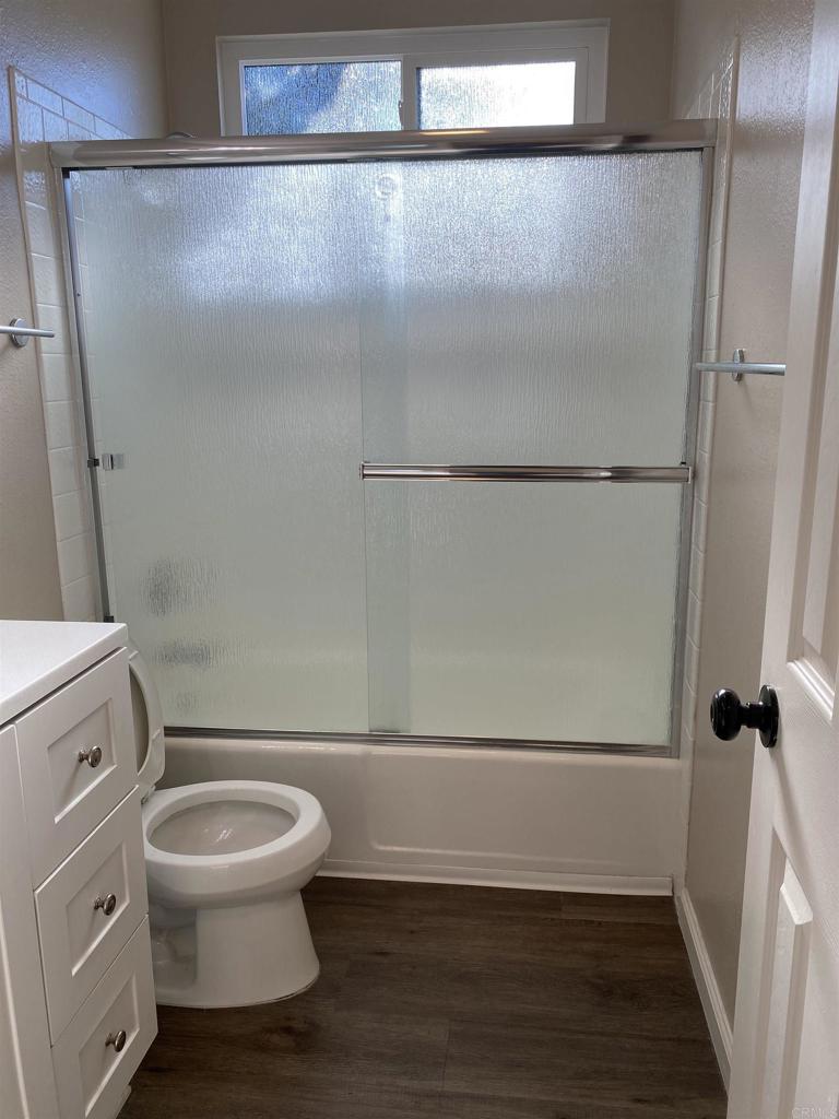 2088 Montgomery Avenue, Unit M Cardiff-by-the-Sea, CA 92007 - Photo 37 of 43 a bathroom with a toilet and a shower