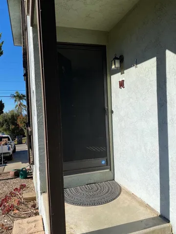 a view of a hallway with a door