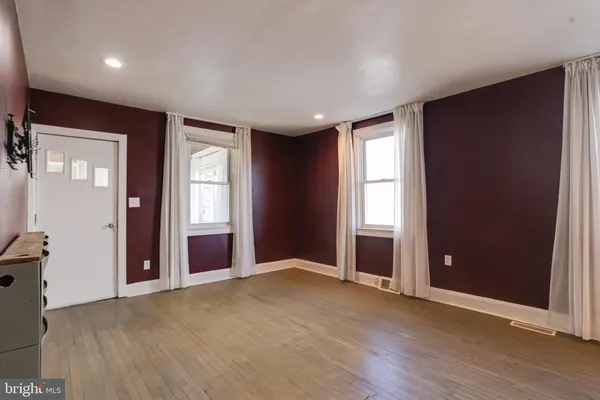 a kitchen with stainless steel appliances granite countertop a refrigerator and a stove