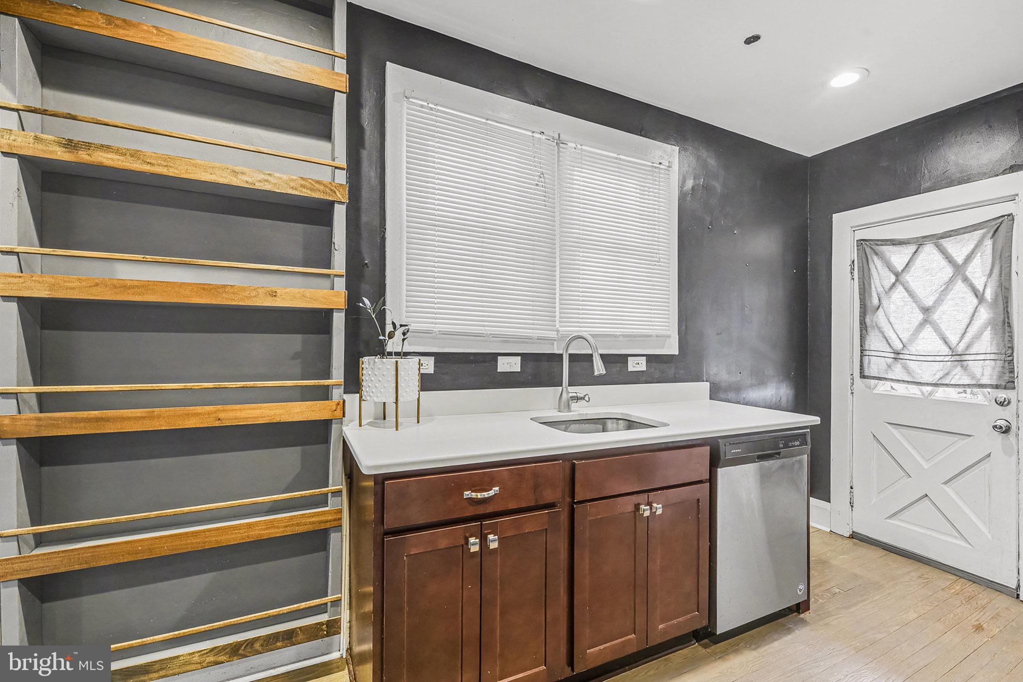 2513 Wagner Avenue Sparrows Point, MD 21219 - Photo 12 of 28 a kitchen with a sink and a window