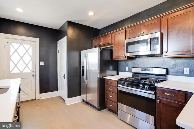 a bathroom with a sink and a window