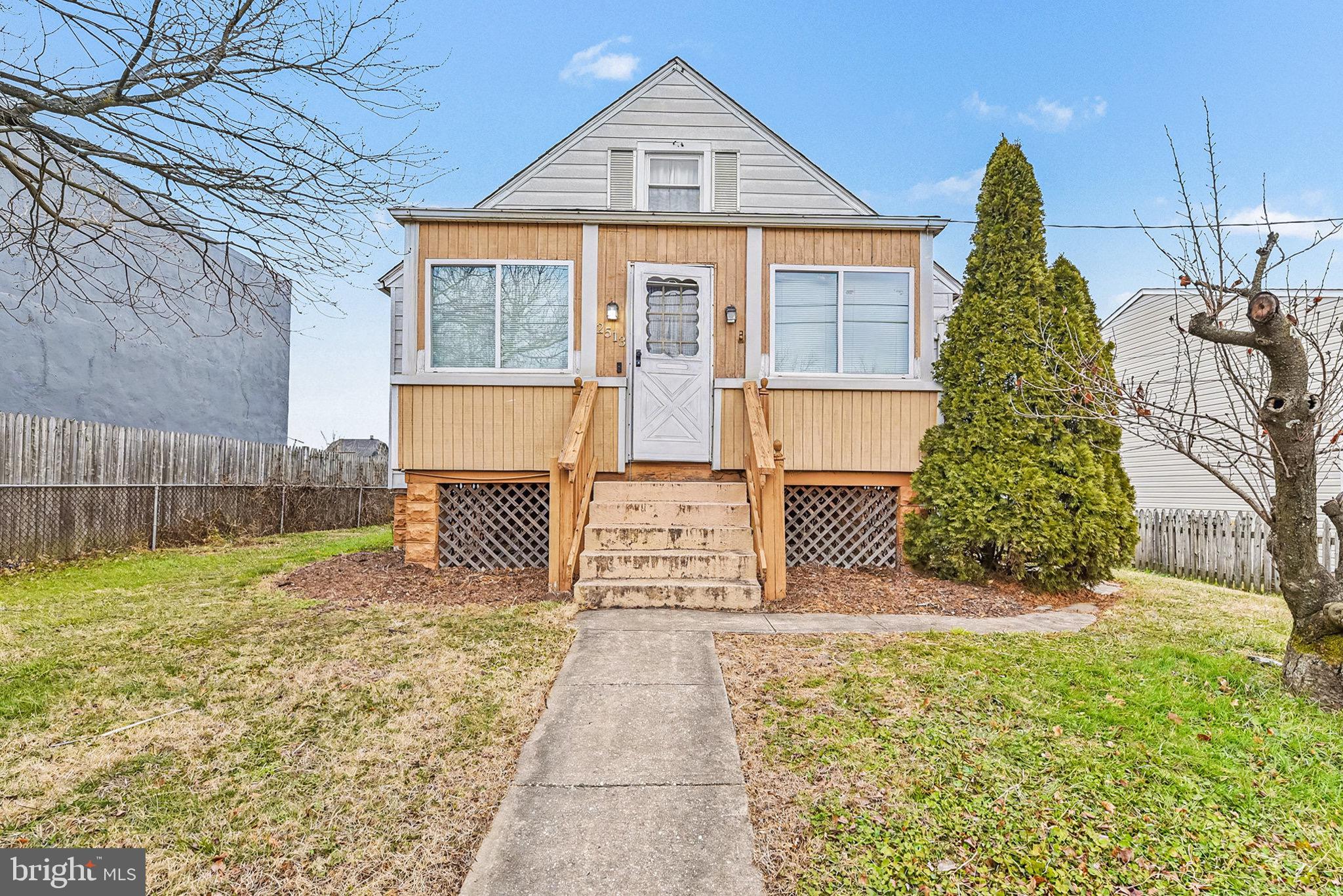 2513 Wagner Avenue Sparrows Point, MD 21219 - Photo 2 of 28 a front view of a house with garden
