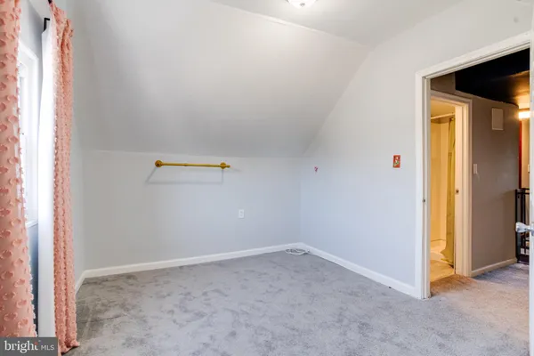 a view of a big room with windows and closet