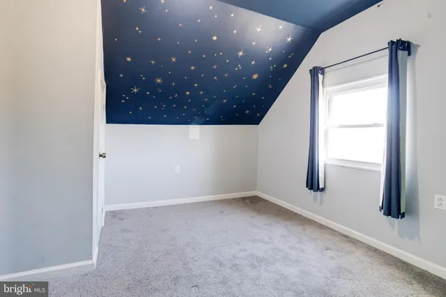 a bathroom with a sink toilet and a mirror