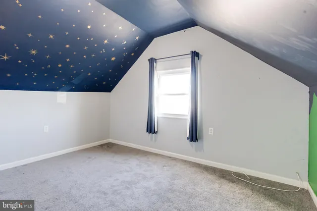 a bathroom with a sink toilet and a mirror