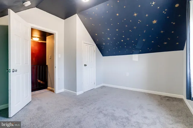 a bathroom with a shower and a mirror