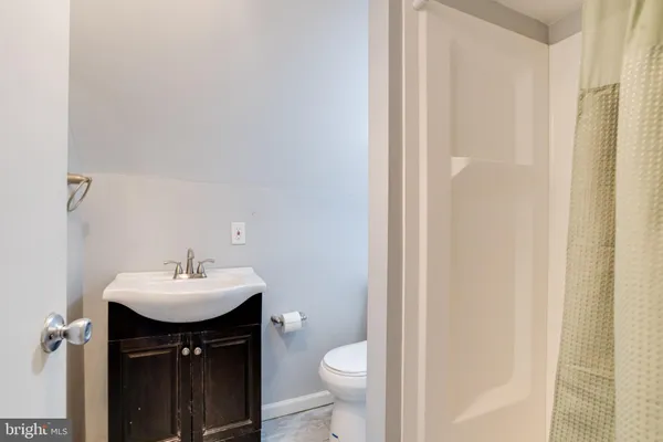 a view of an empty room with wooden roof
