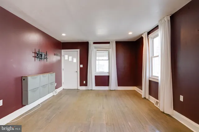 a kitchen with stainless steel appliances kitchen island granite countertop a sink a stove and refrigerator