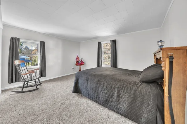 a bedroom with a bed and gym equipment