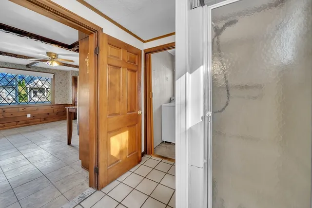 a view of entryway with window and cabinet