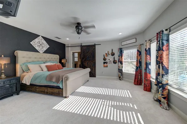 a bedroom with a bed and a walk in closet