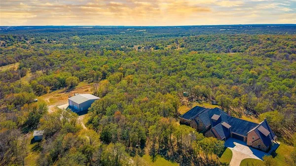 an aerial view of residential houses with outdoor space