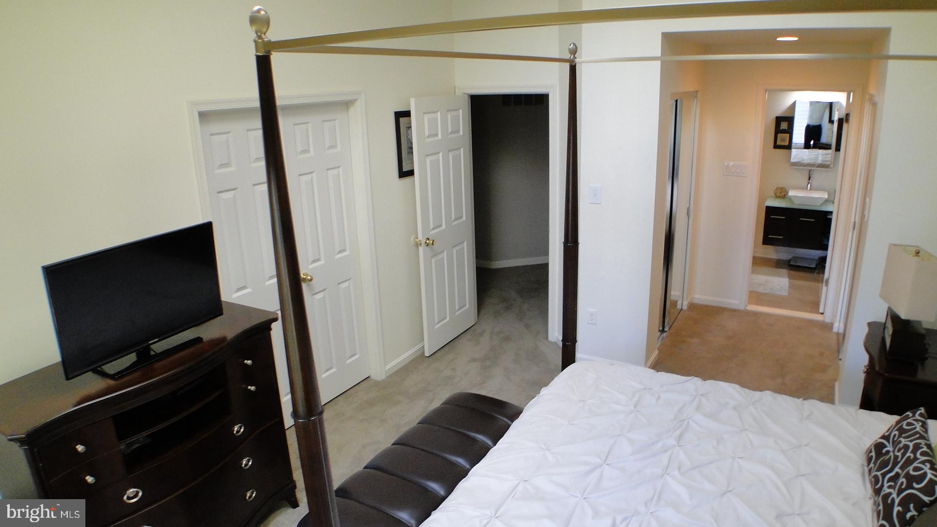 5175 Columbia Road, Unit 1143 Columbia, MD 21044 - Photo 18 of 48 Primary Bedroom with two closets and primary bath.