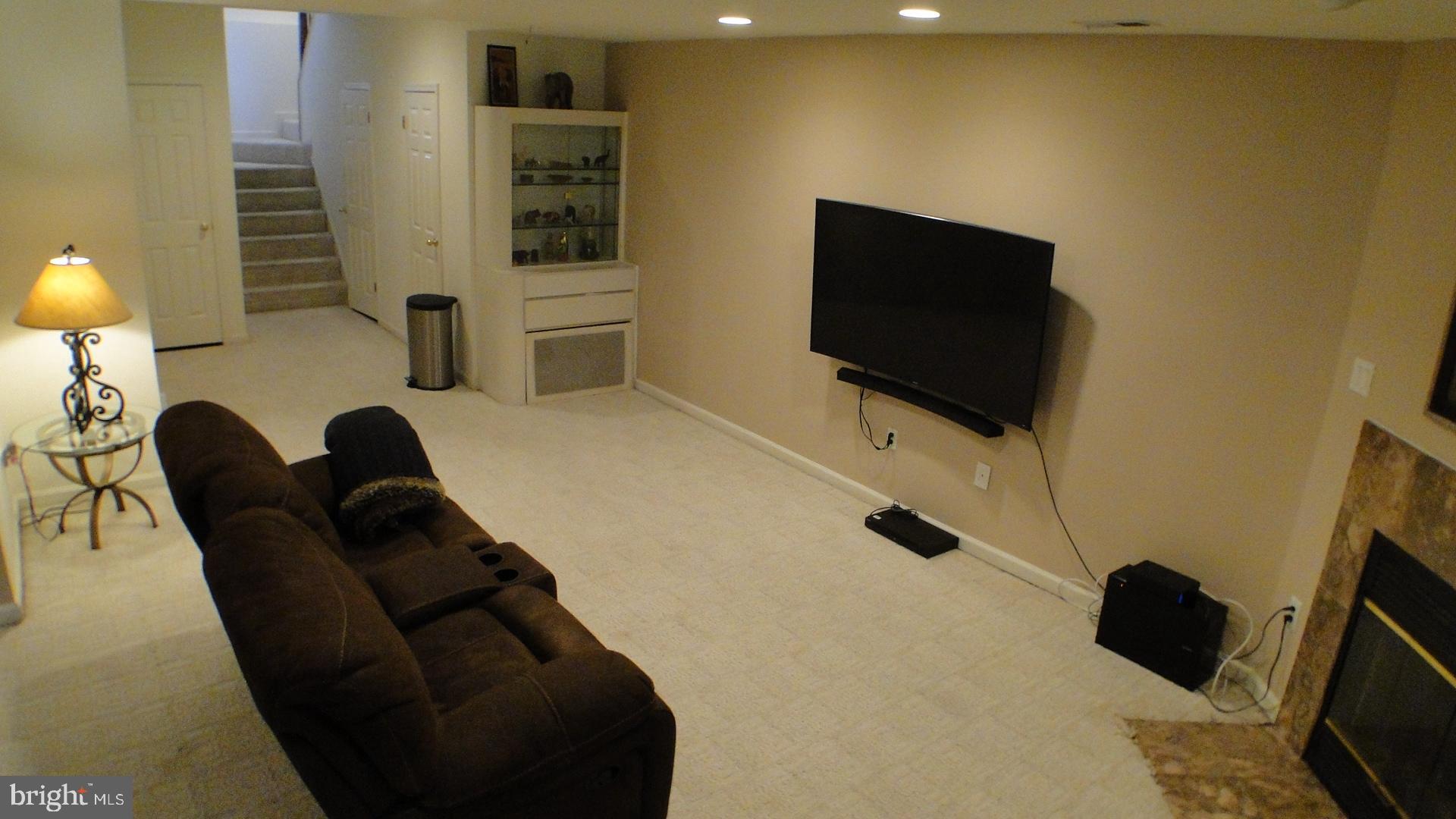 5175 Columbia Road, Unit 1143 Columbia, MD 21044 - Photo 32 of 48 Basement Recreation Room with wood burning FP.