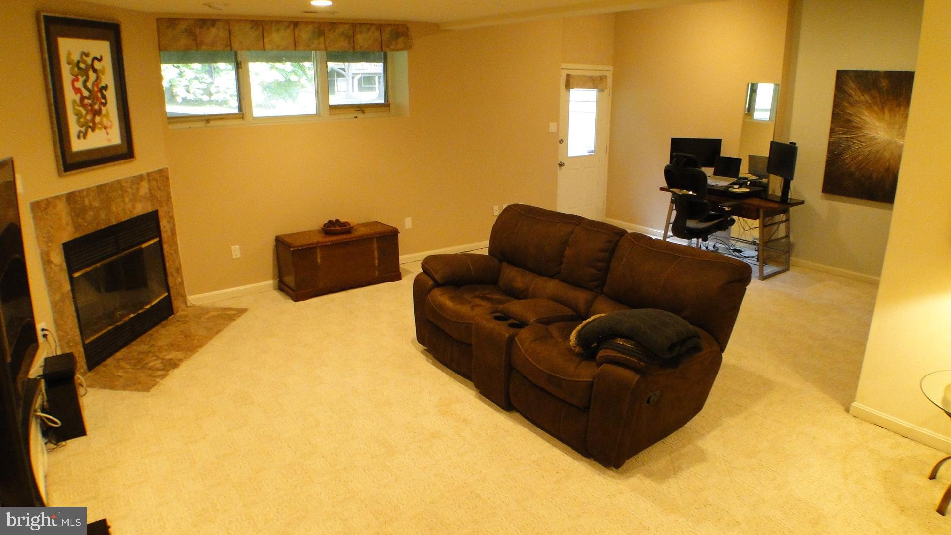 5175 Columbia Road, Unit 1143 Columbia, MD 21044 - Photo 33 of 48 Basement Recreation Room with wood burning FP.