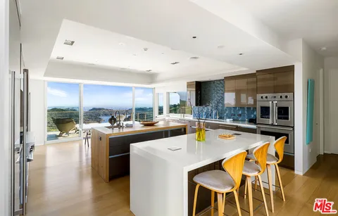 a bedroom with furniture and a flat screen tv
