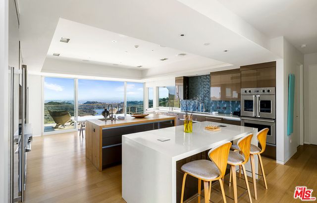 a bedroom with furniture and a flat screen tv