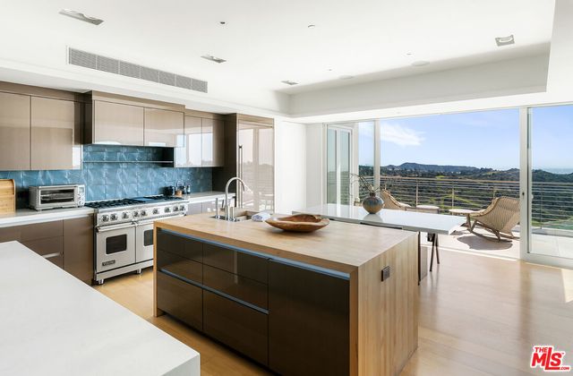 a spacious bedroom with a large bed and a large window