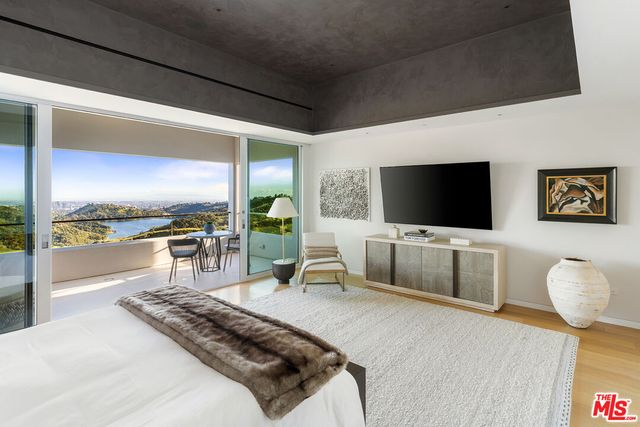 a bedroom with a bed and a couch