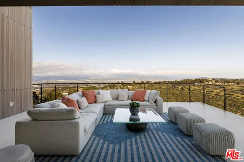 a kitchen with stainless steel appliances a stove a sink and a refrigerator