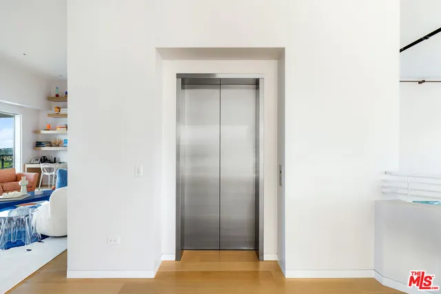 a kitchen with stainless steel appliances a sink a stove and a refrigerator