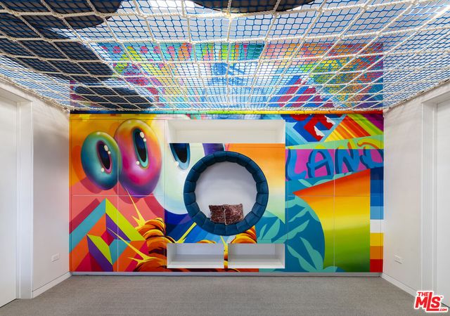 a living room with furniture pool table and a large window