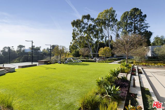 a living room with fireplace furniture and a flat screen tv