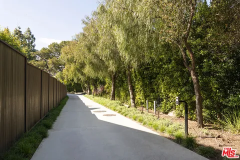 a living room with fireplace furniture and a flat screen tv