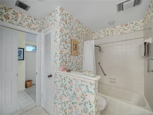 a bathroom with a bathtub and shower