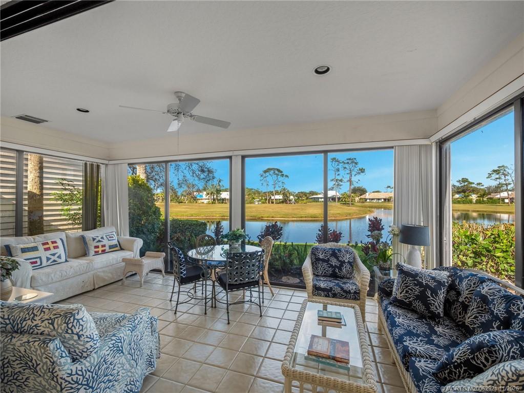 5011 Southeast Brandywine Way Stuart, FL 34997 - Photo 15 of 19 a living room with furniture and a large window
