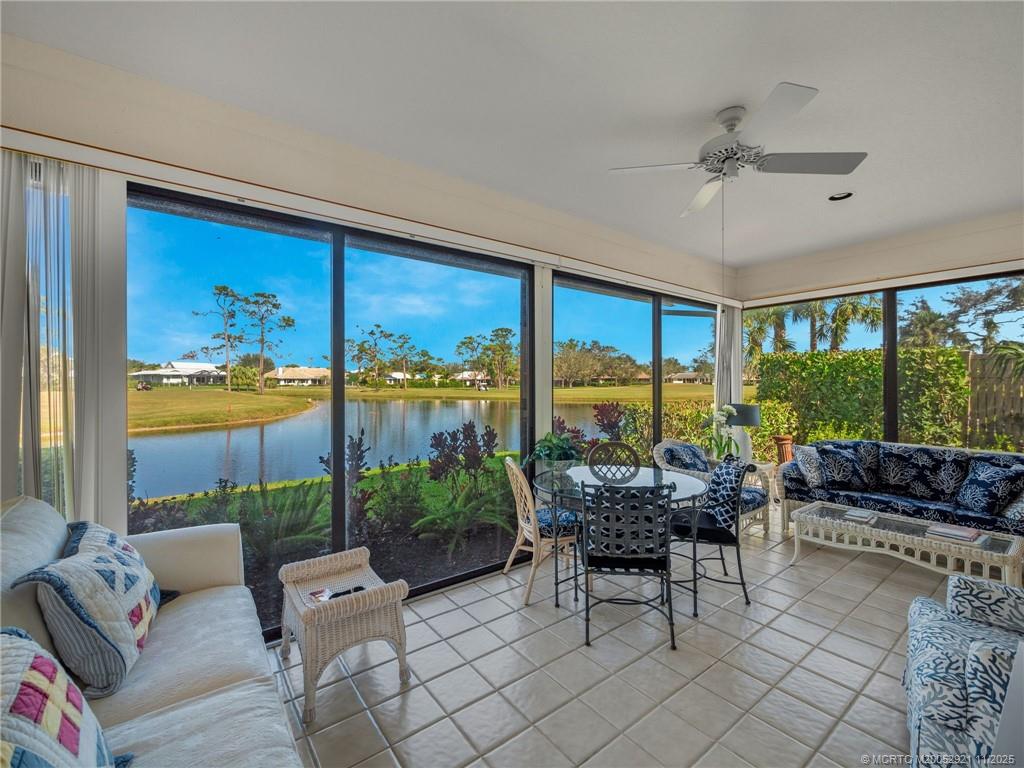 5011 Southeast Brandywine Way Stuart, FL 34997 - Photo 16 of 19 a living room with furniture and a large window
